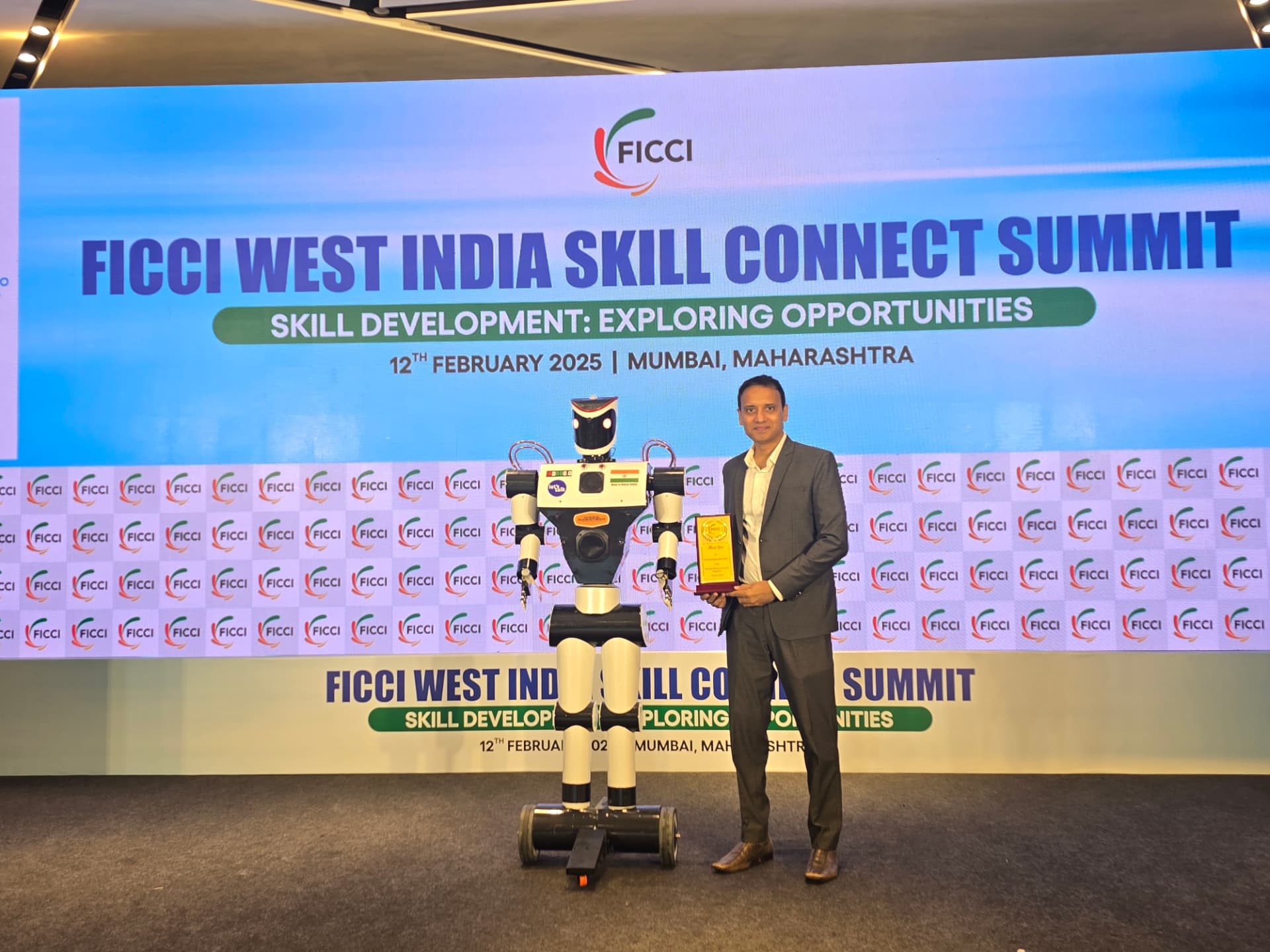 Mayank Saxena receiving an award at the FICCI West India Skill Connect Summit